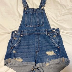 Ripped denim overalls